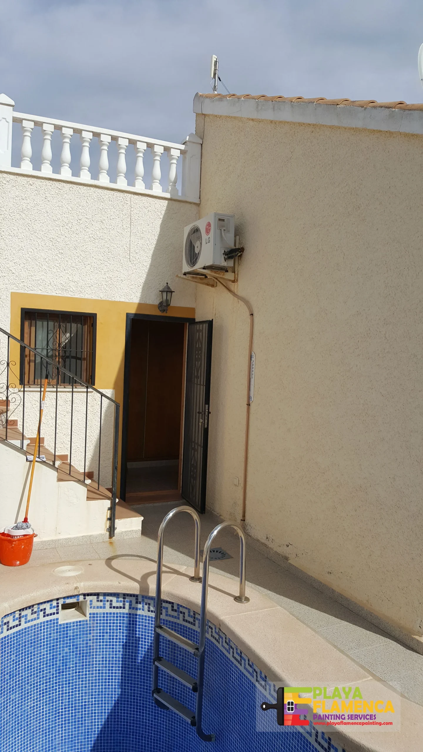 Full villa exterior, including gates and balustrades — before painting