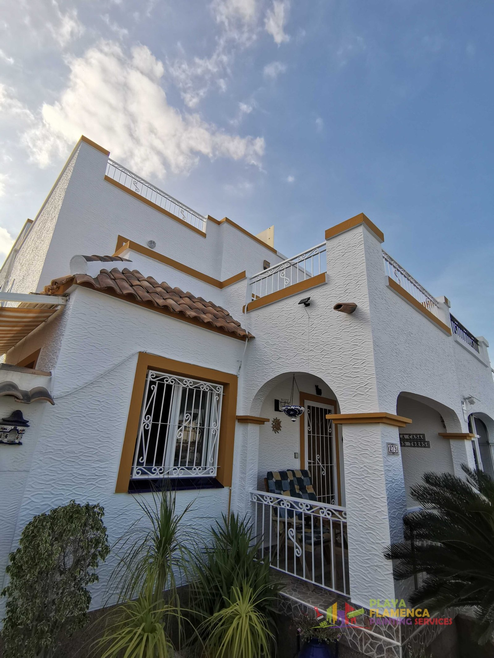 Full villa exterior, including gates and balustrades — after painting